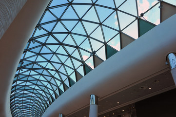 Fototapeta premium Reinforced concrete construction. Ceiling. New technologies. Arc polycarbonate canopy and reinforced concrete construction. Metal construction.