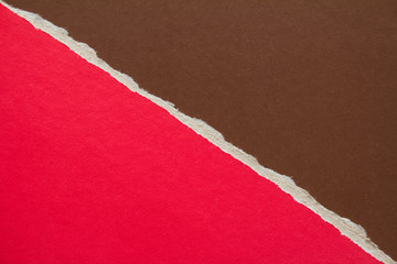 Brown and red torn sheet of cardboard paper with diagonal border texture background. Can be used...