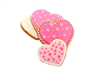 background from pink cookies heart shaped with different patterns, isolated