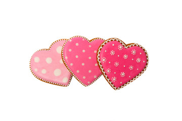 background from pink cookies heart shaped with different patterns, isolated