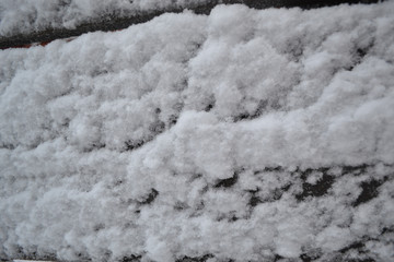 Winter snow. Snowy texture Top view of snow. Texture for design. Snowy white texture. Snowflakes.
