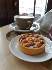 cup of coffee and cake on table
