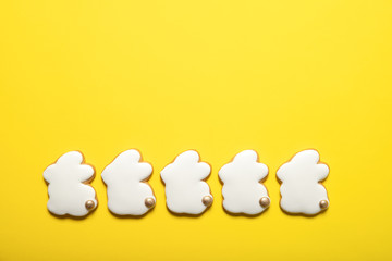 Easter cookies on a yellow background. Easter bunnies. Top view. Place for text.