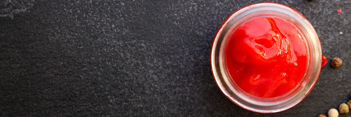 tomato sauce in a gravy boat on the table (sugo or ketchup) menu concept. background. top view. copy space