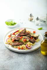 Beef steak salad with pasta and vegetables