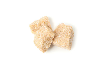 Brown sugar slices isolated on white background, close up