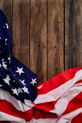 American flag on old brown wooden table