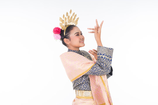 A beautiful Malaysian traditional female dancer wearing traditional dance outfit. Half length portrait isolated in white. Landscape orientation.