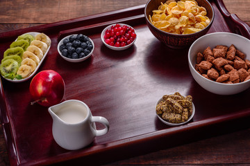 Delicious breakfast with fresh croissants and ripe berries