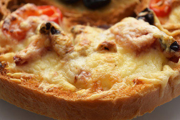 Croutons with cheese and tomatoes