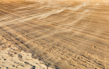 Sand background, sandy waves on windy day on the beach or in desert, natural background. Strong...