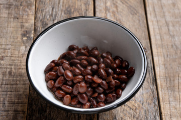 Fototapeta premium Mexican black beans on wooden background