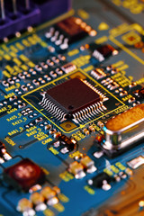 Electronic circuit board with electronic components such as chips close up. The concept of the electronic computer hardware technology.