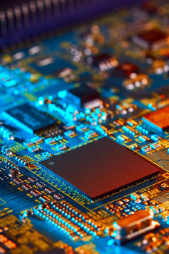 Electronic circuit board with electronic components such as chips close up. The concept of the electronic computer hardware technology.