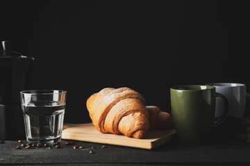 Composition with croissants on wooden table, space for text