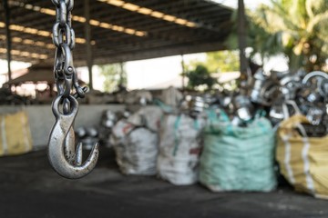 used forklift hook in the recycling industry plant with selective focus.