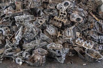 Stack of aluminium alloy cylinder head for recycling. . Scrap engines parts for recycling.