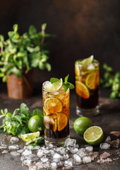 Cuba Libre with brown rum, cola, mint and lime. Cuba Libre or long island iced tea cocktail with...