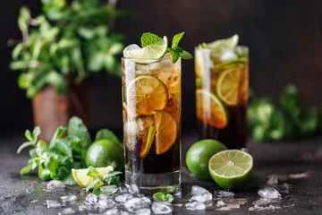 Cuba Libre with brown rum, cola, mint and lime. Cuba Libre or long island iced tea cocktail with...