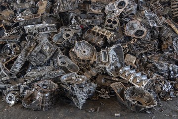 Stack of aluminium alloy cylinder head for recycling. . Scrap engines parts for recycling.