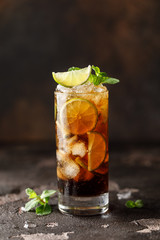 Cuba Libre with brown rum, cola, mint and lime. Cuba Libre or long island iced tea cocktail with...