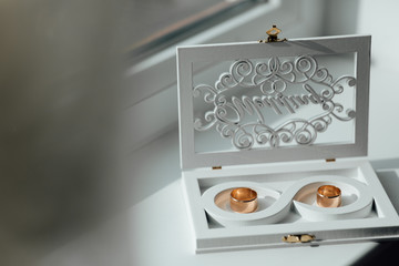 Wedding rings in a box. Accessories for the bride and groom for the wedding.  Love and wedding concept