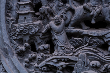 Chongqing, China - March 21, 2018: Bas-relief at an ancient Buddhist temple in the chinese city of...