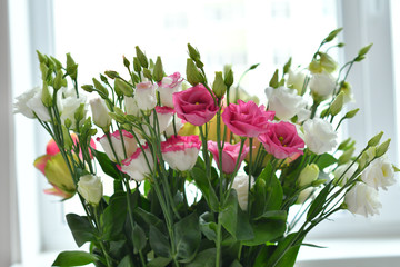 Beautiful Eustoma and Roses flowers, white eustoma on white background.Wedding invitation in minimalist style with eustoma. Template for greeting wedding or spring card. Copy space. Mother's day card