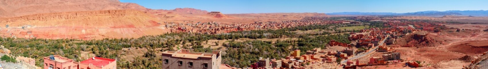 Fototapeta premium Bright landscape of Morocco, breathtaking curves of mountains, stunning combination of hills & farm land,inadvertent distribution of houses & huts, raw impression of pure nature.