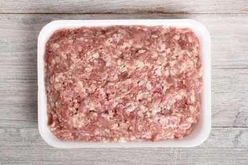 Ground chicken in polystyrene food tray
