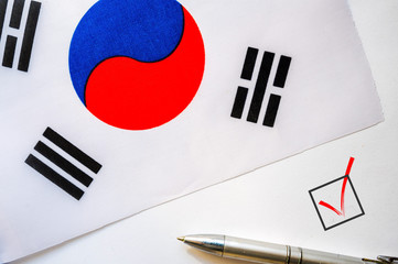Pencil, Flag of South Korea and check mark on paper sheet