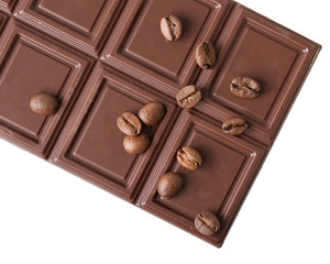 chocolate bar with scattering of coffee beans top view isolated