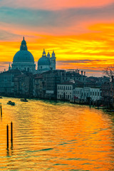 Fototapeta na wymiar Sunset on Grand Canal and Basilica of Santa Maria della Salute, Venice, Italy 