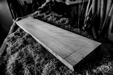 Lumber on work table and chips wood - Black and White