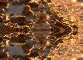 A buddha figure meditating on the coast