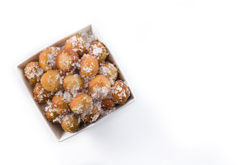 Carnival fritters or buñuelos de viento in bowl for holy week isolated on whiop view. Copy spacete background. T