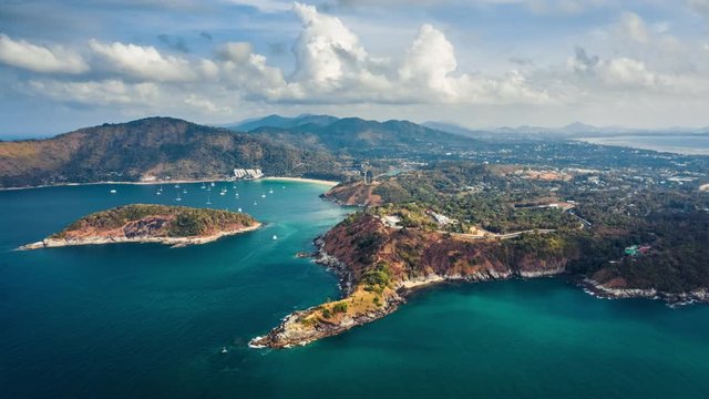 Hyperlapse of southern area of Phuket island with its beaches and islets and clouds running in the sky. Thailand. Timelapse with descending camera