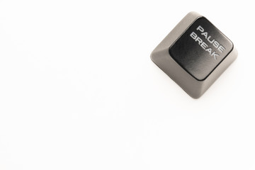 black keyboard button with a white inscription Pause Break in the corner on a white background