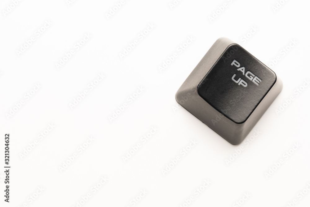 Fototapete black keyboard button with a white inscription page up in the corner on a white background