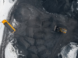 Open pit mine winter, extractive industry for coal, top view aerial drone