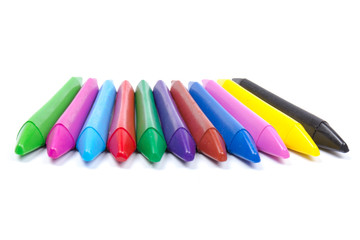 Colored wax pencils. A bunch on white background close-up