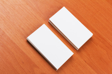 white blank business cards on wooden background.close-up