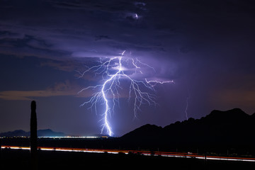 Lightning bolt from a storm over a city