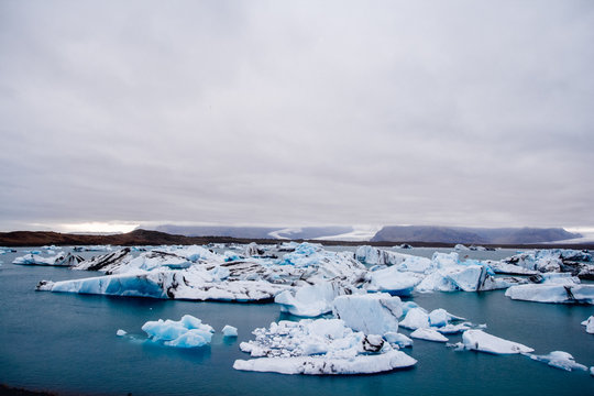 Icebergs in Jokulsarlon lagoon beneath Breidamerkurjokull glacier Sudhurland, Iceland. Place for text or advertising