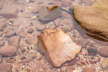 Stone image on the beach and sunset light background image