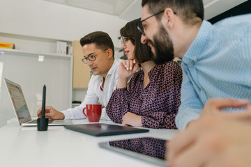 Web design team discussing a website solution