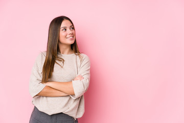 Young caucasian woman posing isolated smiling confident with crossed arms.