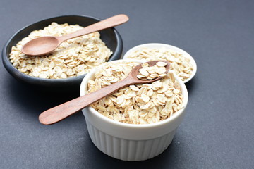 Natural oatmeal on light wooden background