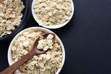 Natural oatmeal on light wooden background