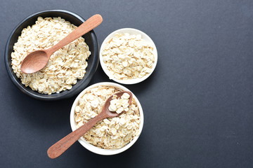 Natural oatmeal on light wooden background